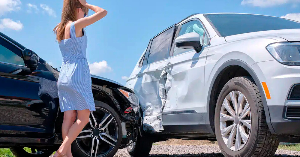 Side-impact car accident with visible door damage as a driver reacts at the scene, highlighting insurance assessment and Diminished Value Claim Florida after a vehicle collision.